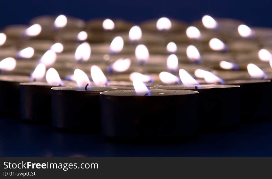 Burning candles close up view.