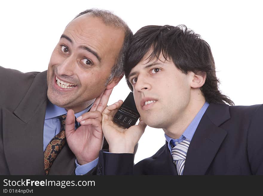 Two successful businessman trying to listen something at a cellphone