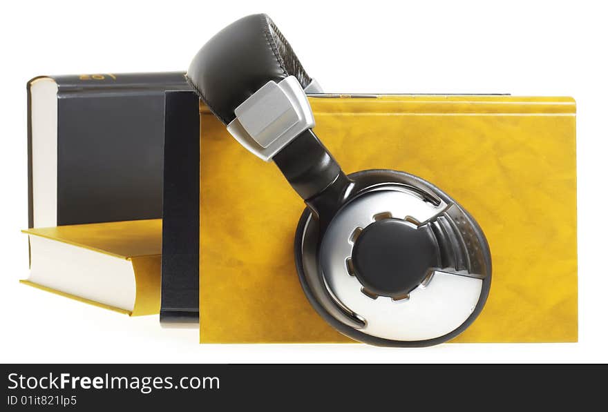 headphones and books isolated on white