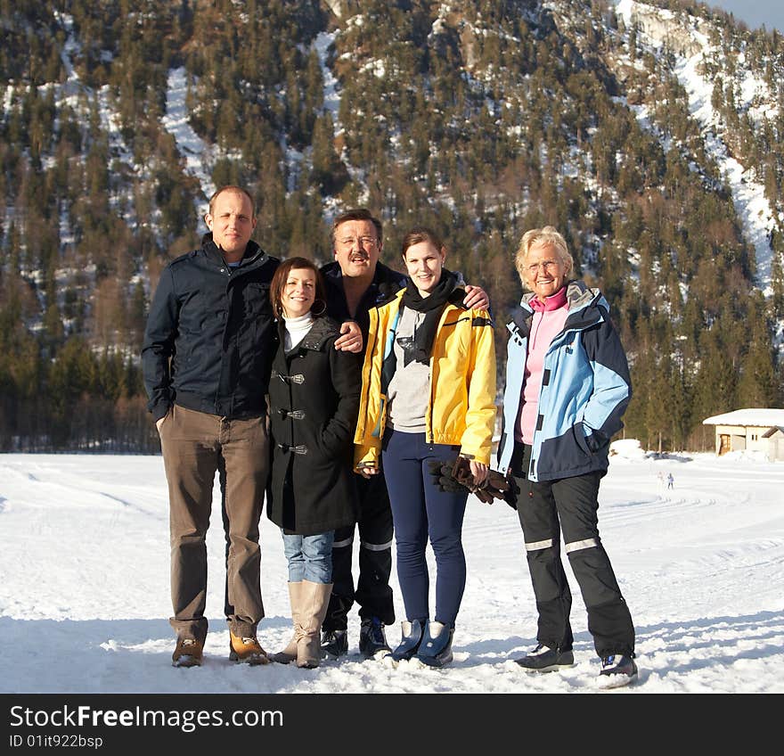 Family in a and outdoor winter setting. Family in a and outdoor winter setting.