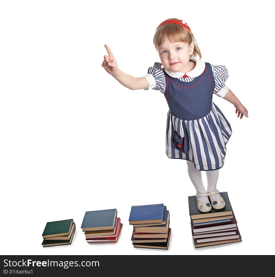 Little girl with book on white background