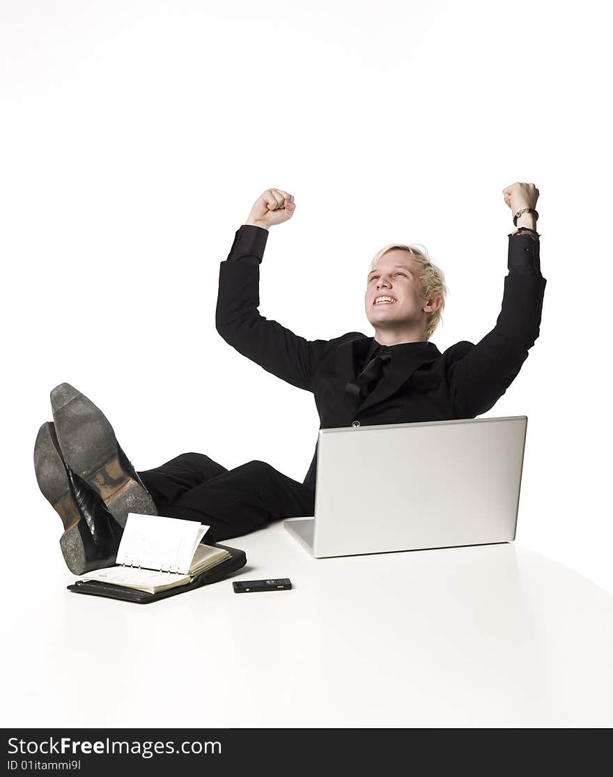 Happy boy siting infront of a computer