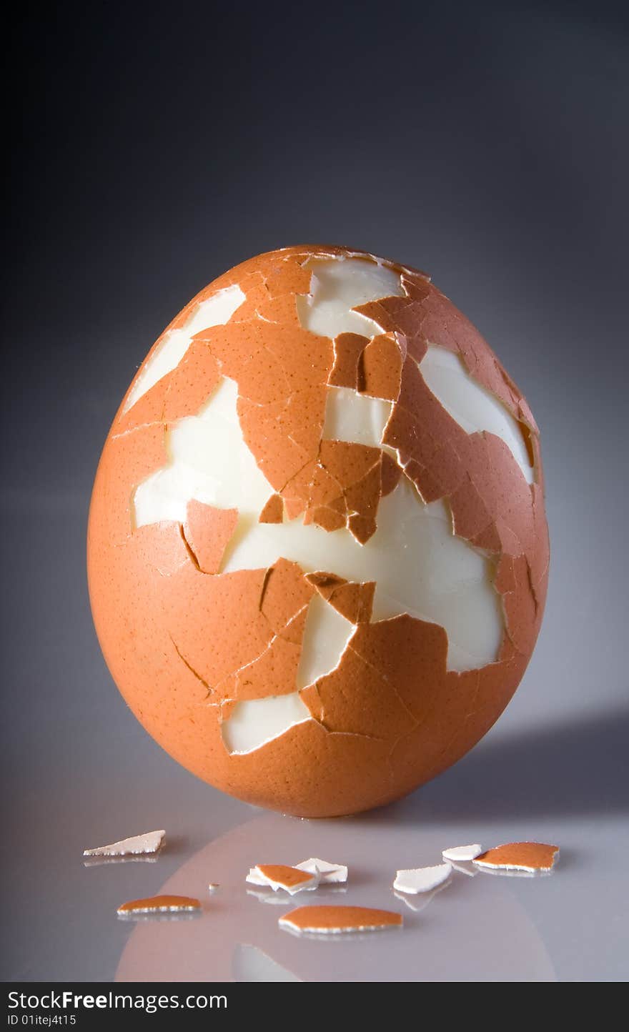 Cracked egg with pieces of shell