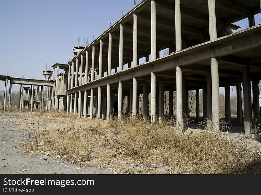 Abandoned building with columns forming a corridor