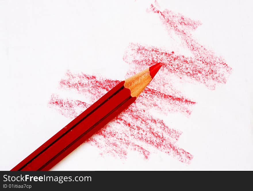 Red crayon doodle on sheet. Red crayon doodle on sheet