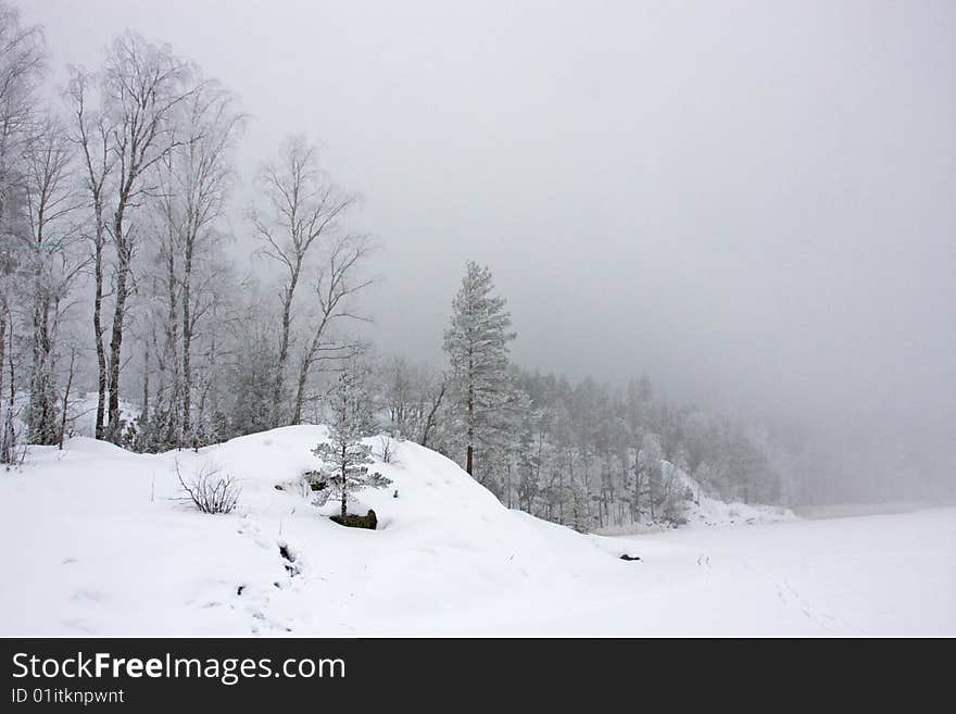 Winter morning on forest lake. Karelia, Russia. Winter morning on forest lake. Karelia, Russia