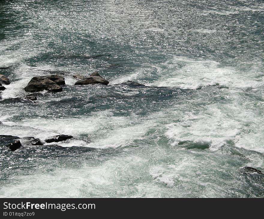 Large green river and rock