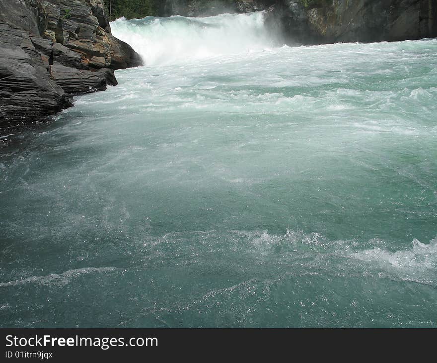 Large green river and rock