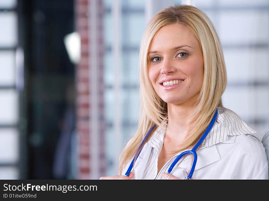 Young female doctor standing in a modern office