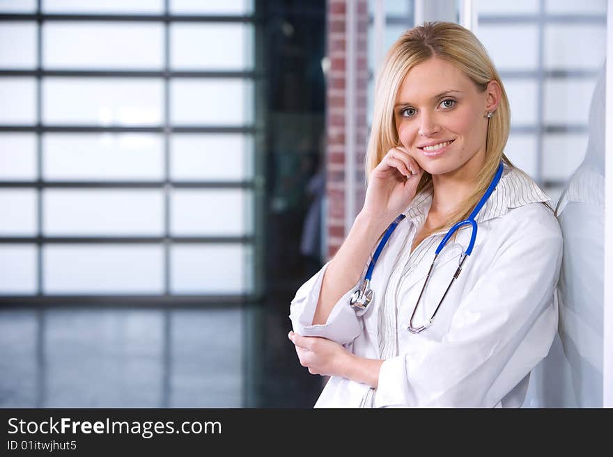 Young female doctor standing in a modern office