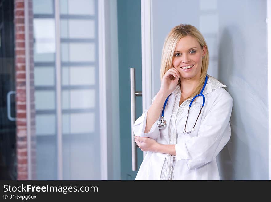 Young female doctor standing in a modern office