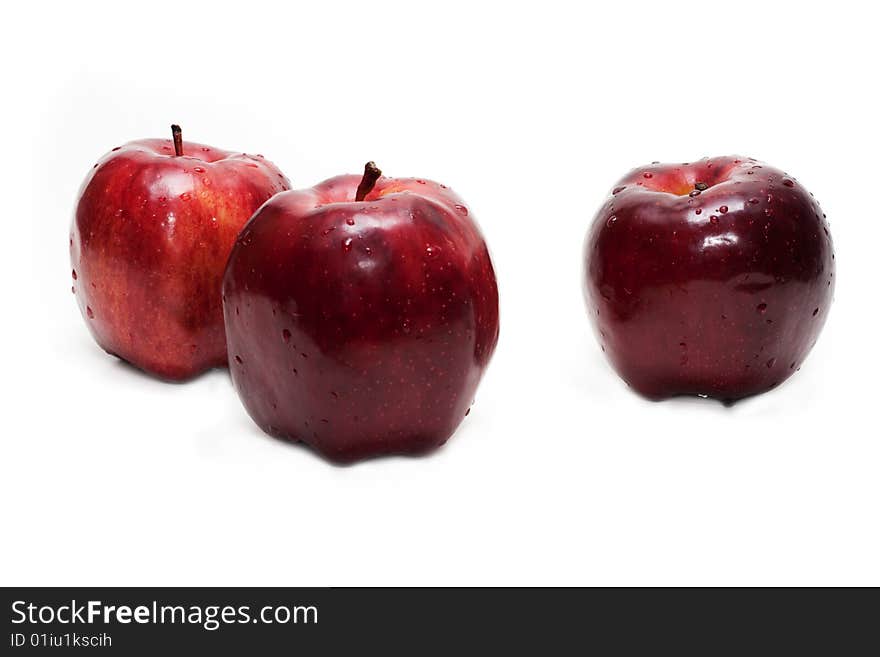 Three red apples, in droplet grow insulated on white background. Three red apples, in droplet grow insulated on white background