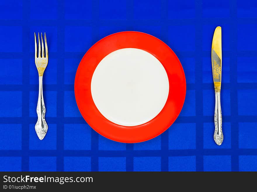 Plate, Knife And Fork On Table Cloth