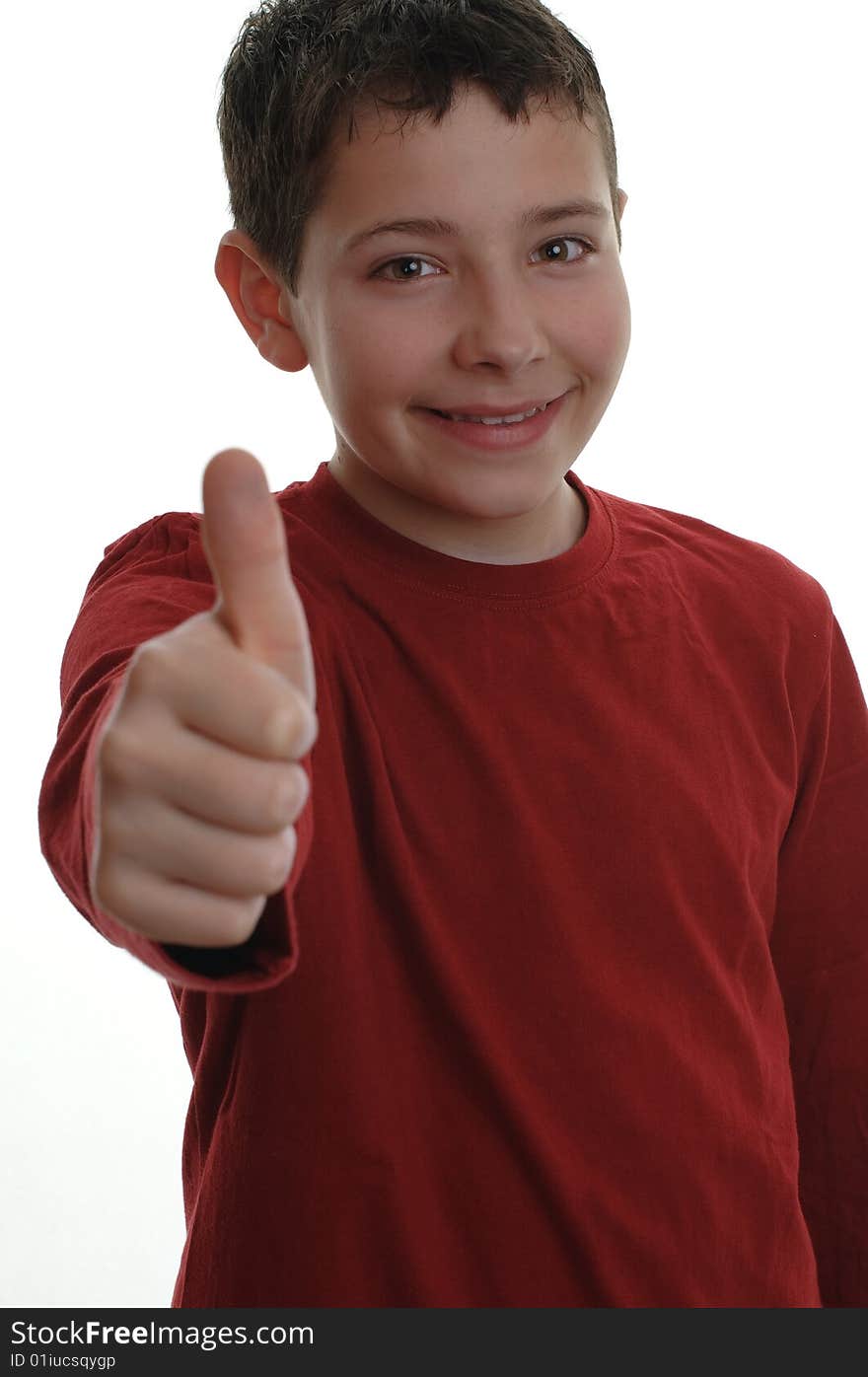 Young boy smiling, with thumb up, focus on his face isolated on white. Young boy smiling, with thumb up, focus on his face isolated on white