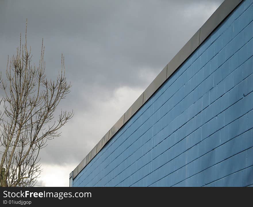 A blue industrial brick building. A blue industrial brick building