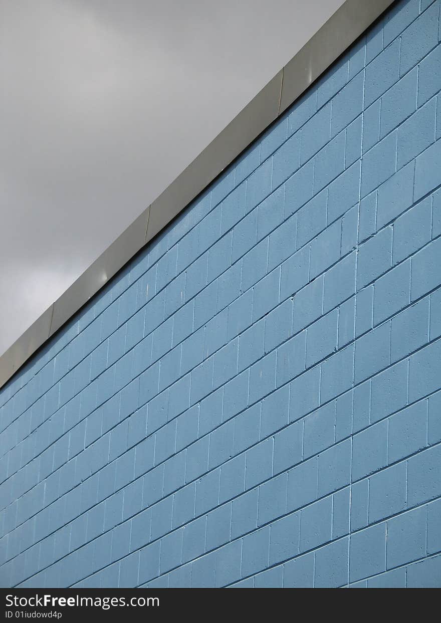 A blue industrial brick building. A blue industrial brick building