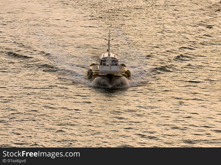 Tug Plowing Through Dawn Water