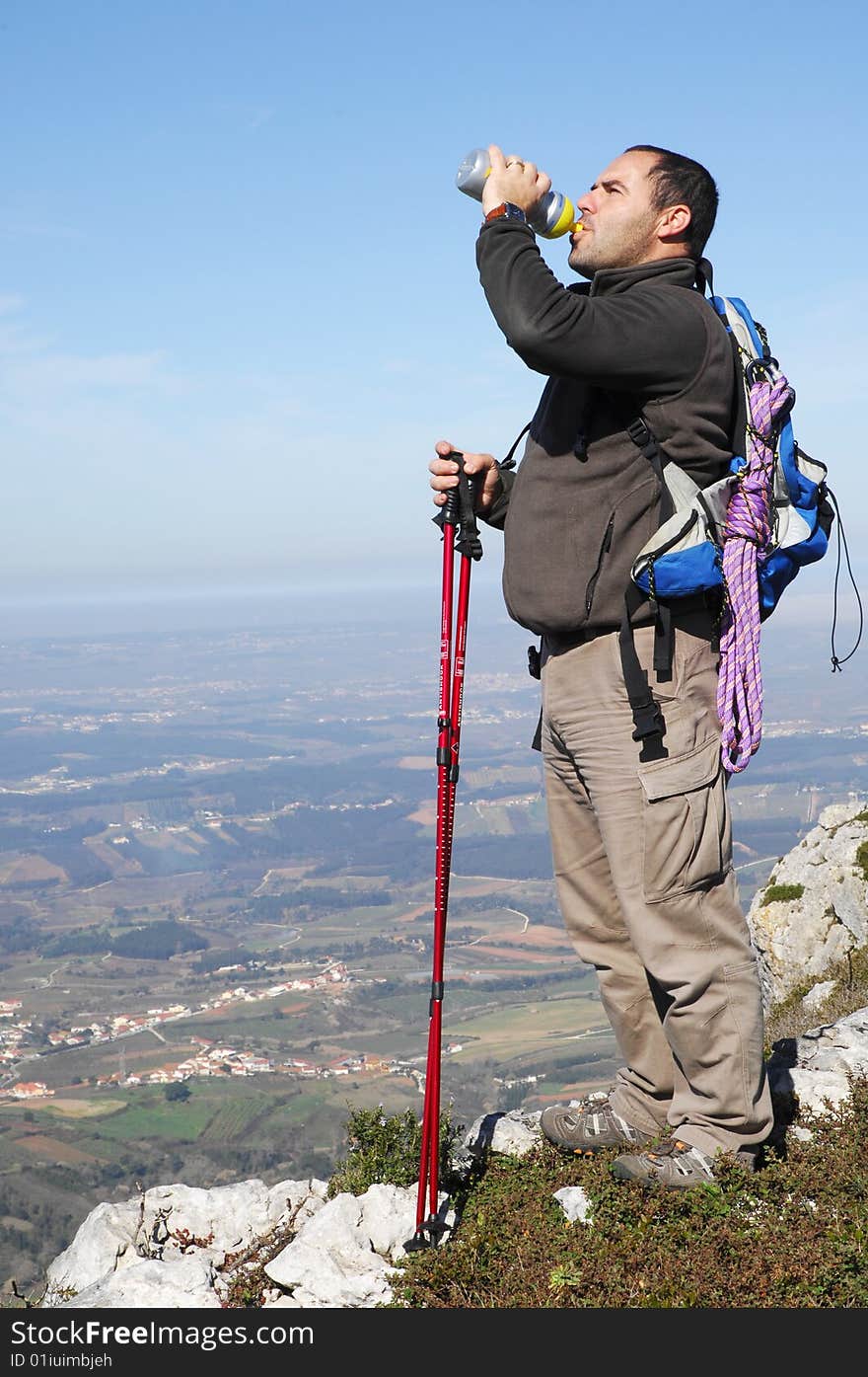 Man In A Top Of A In Mountain Hiking