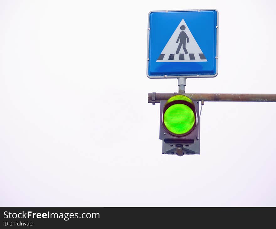 Go light showing green at a pedestrian  crossing. Go light showing green at a pedestrian  crossing