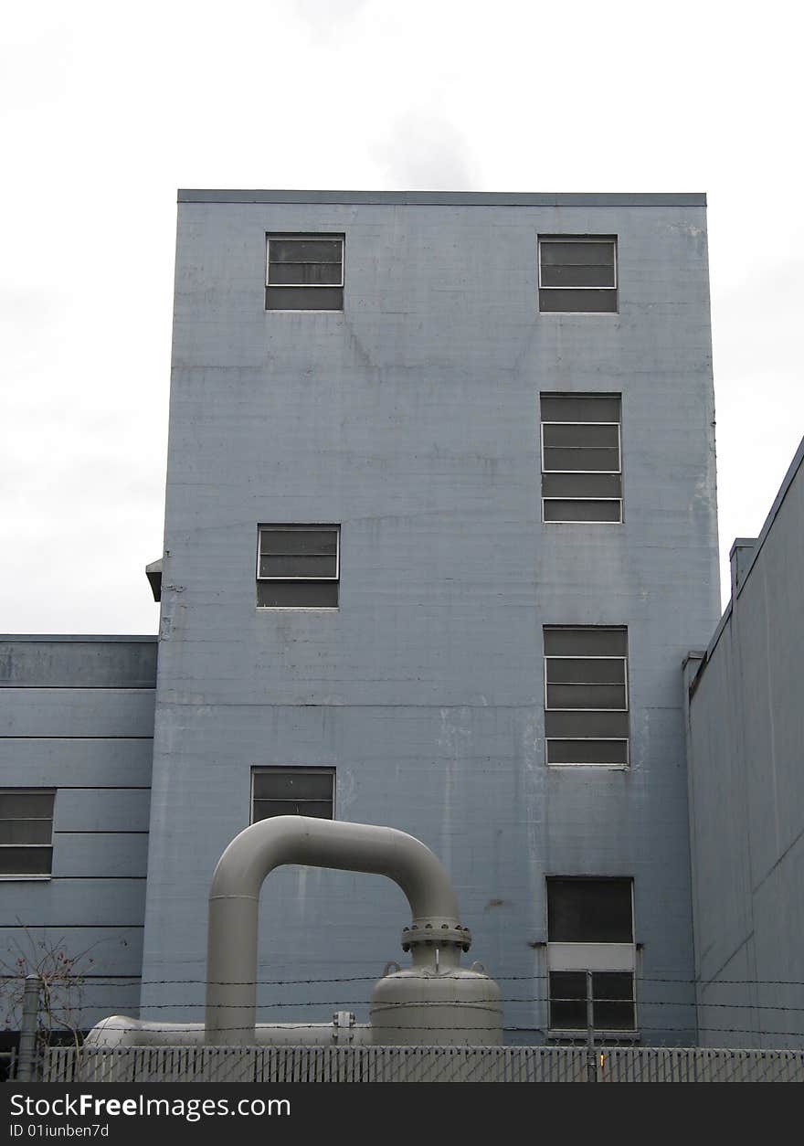 Large industrial building with pipes