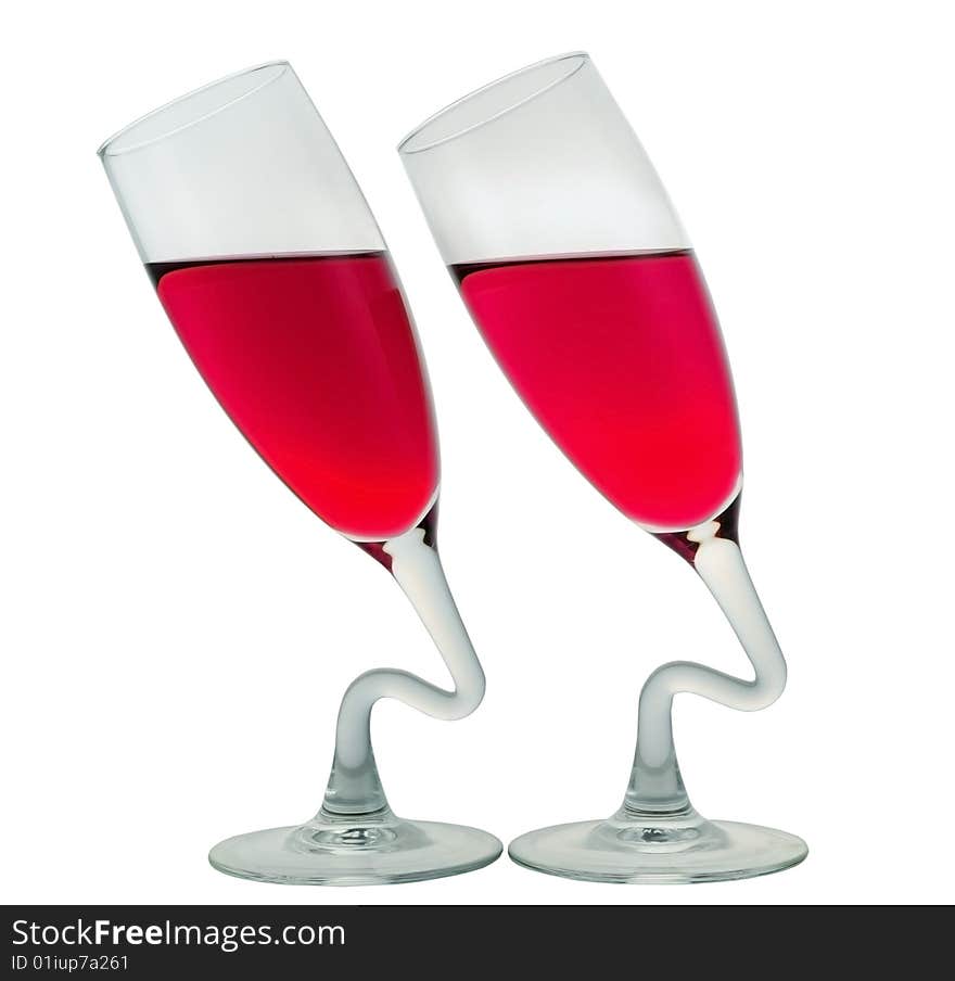 Two glasses with the coloured transparent liquid. Two glasses with the coloured transparent liquid