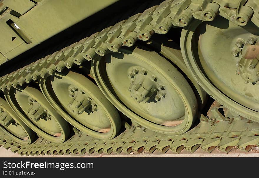 Close up view of the wheels and tracks on a Howitzer, that has been restored and sits on display in a city park in Great Bend Kansas. Close up view of the wheels and tracks on a Howitzer, that has been restored and sits on display in a city park in Great Bend Kansas.