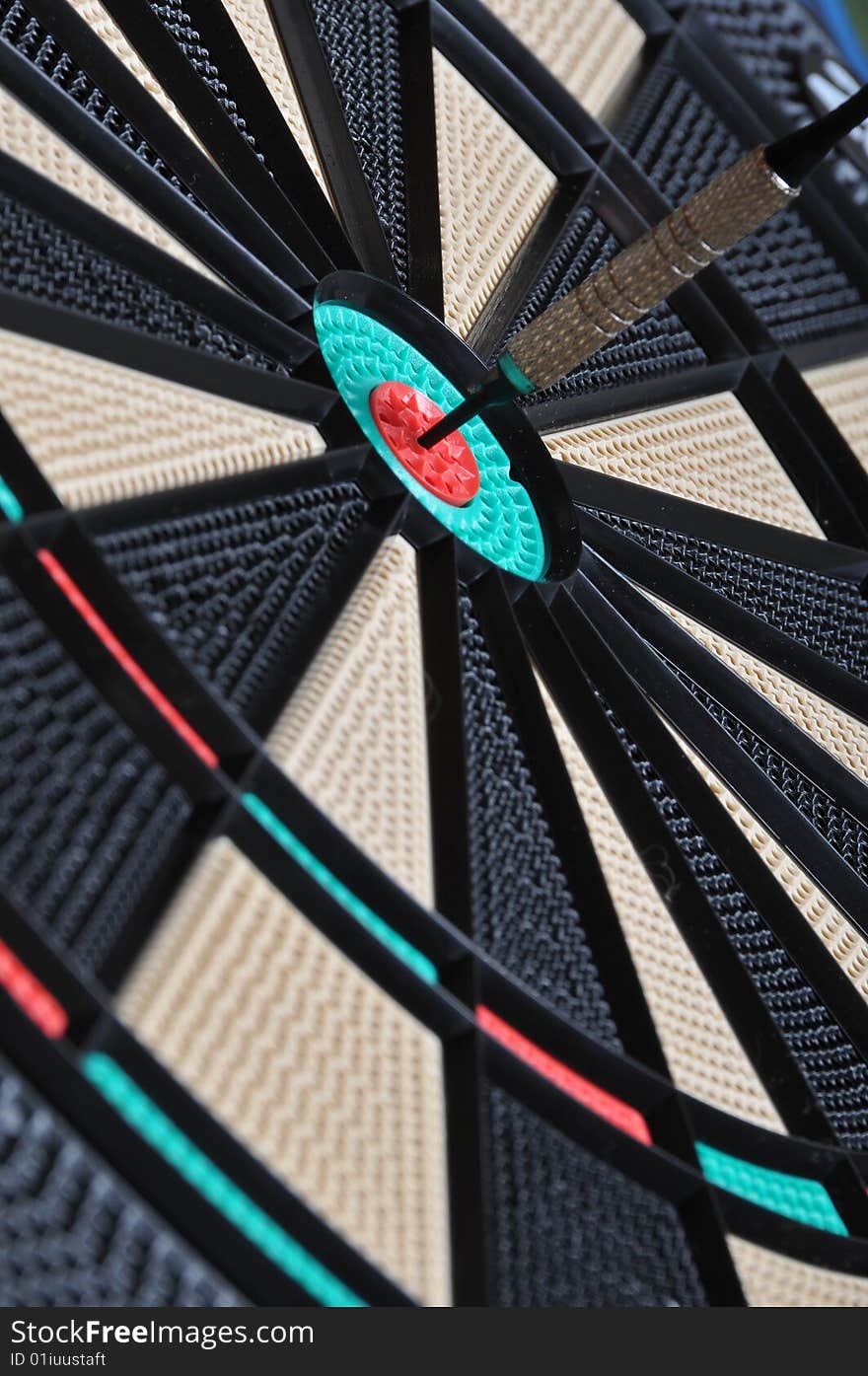 Darts board with one dart stuck. Darts board with one dart stuck