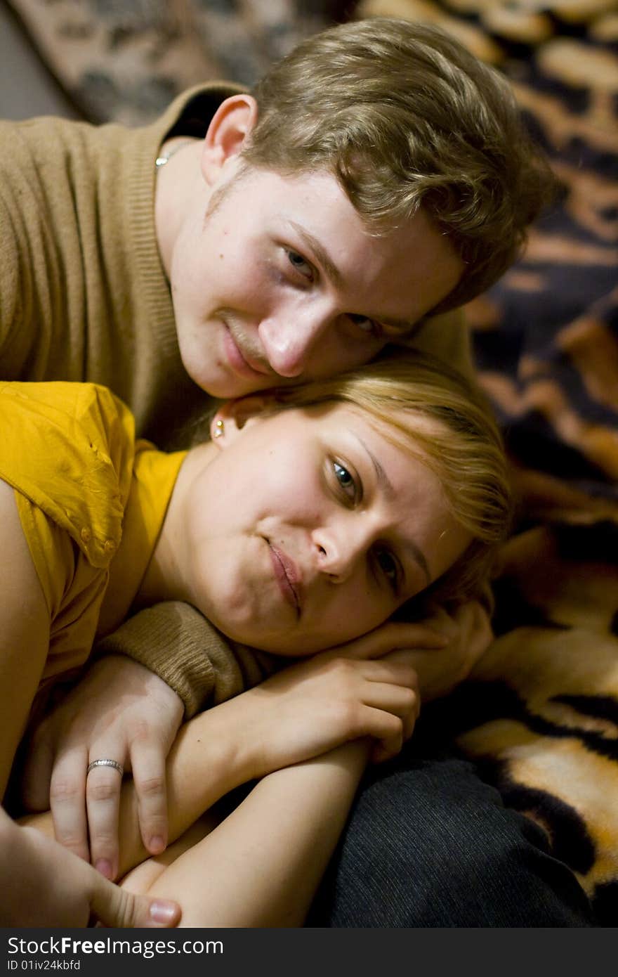 Happy young couple is happy. The girl and the young man are smiling. Happy young couple is happy. The girl and the young man are smiling.