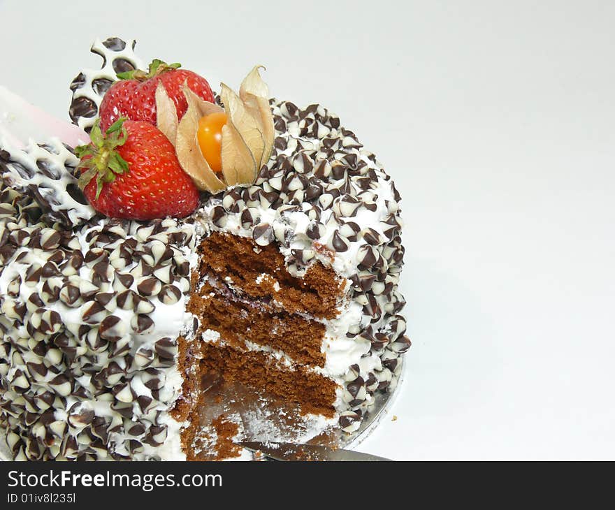 Cut Cake With Chocolate Chips And Berries (left)