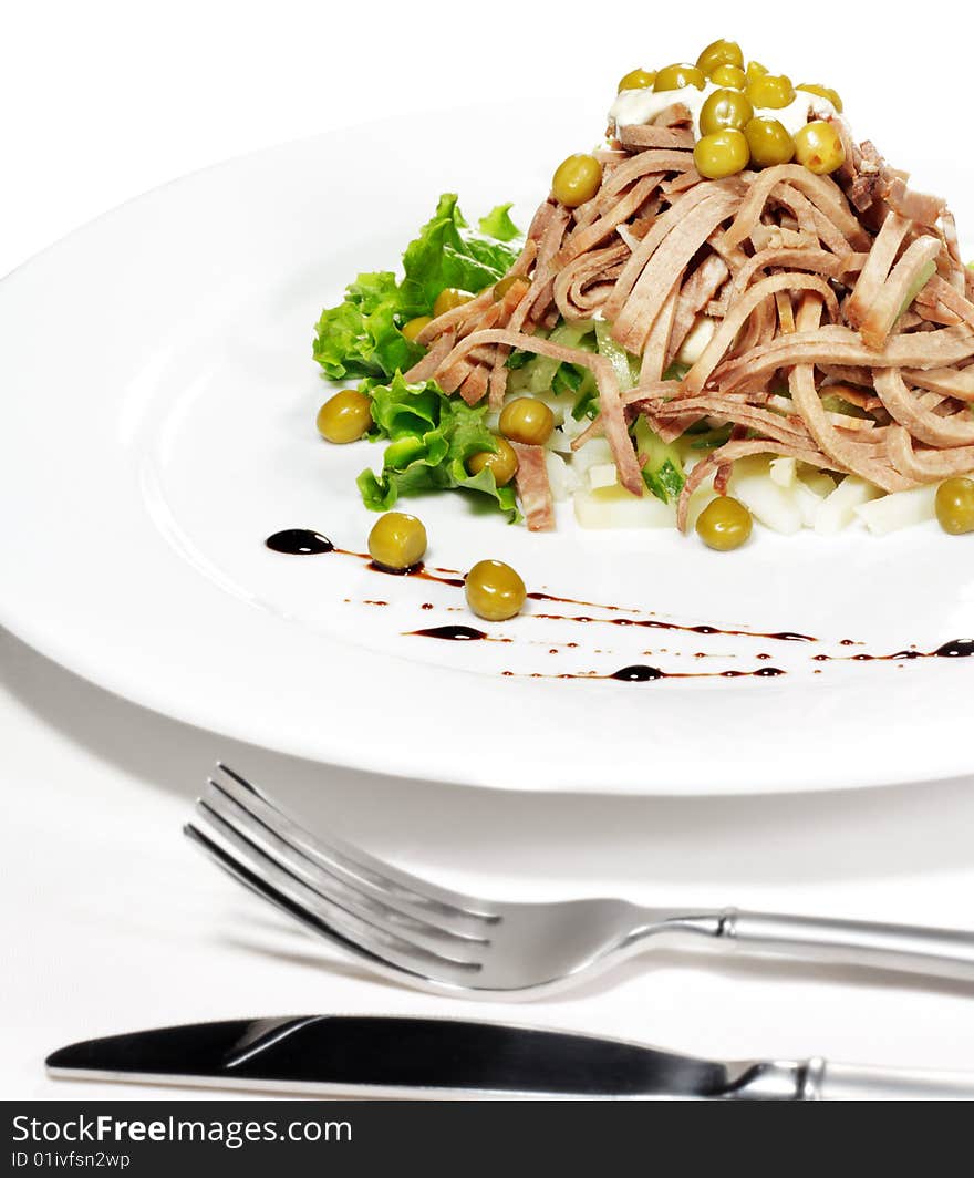 Green Peas and Meat Salad Served with Salad Leaves and Sauce. Isolated on White Background