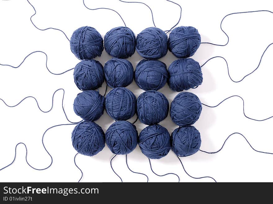 Blue threads and clews  isolated on a white background. Blue threads and clews  isolated on a white background