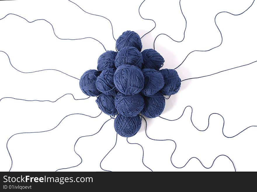 Blue threads and clews  isolated on a white background. Blue threads and clews  isolated on a white background