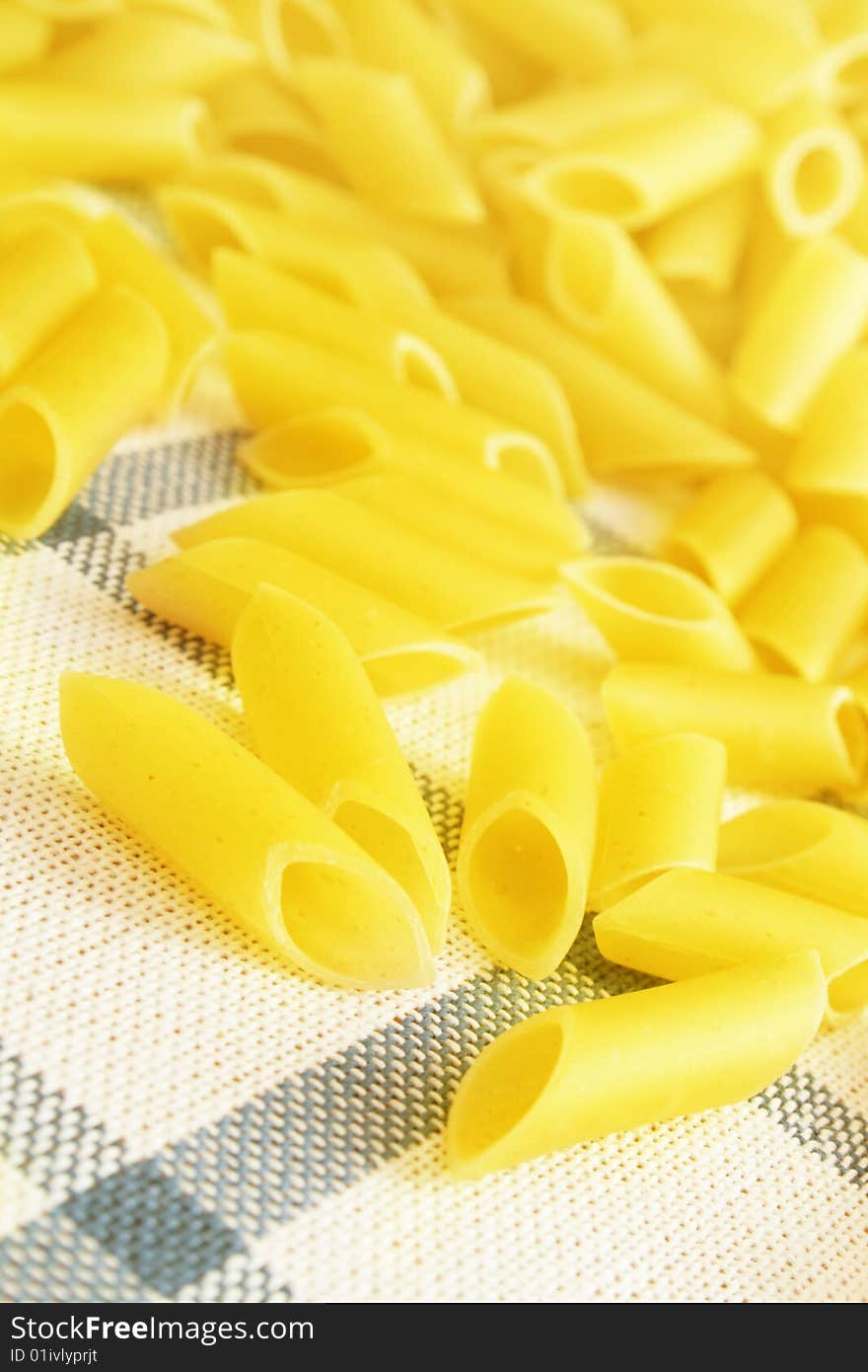 Uncooked pasta on the table. Uncooked pasta on the table.