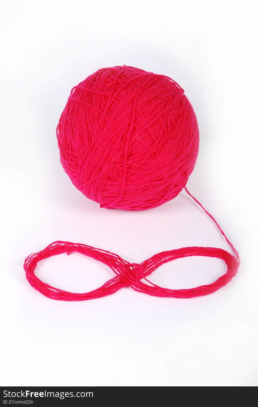 Red threads and clew  isolated on a white background. Red threads and clew  isolated on a white background