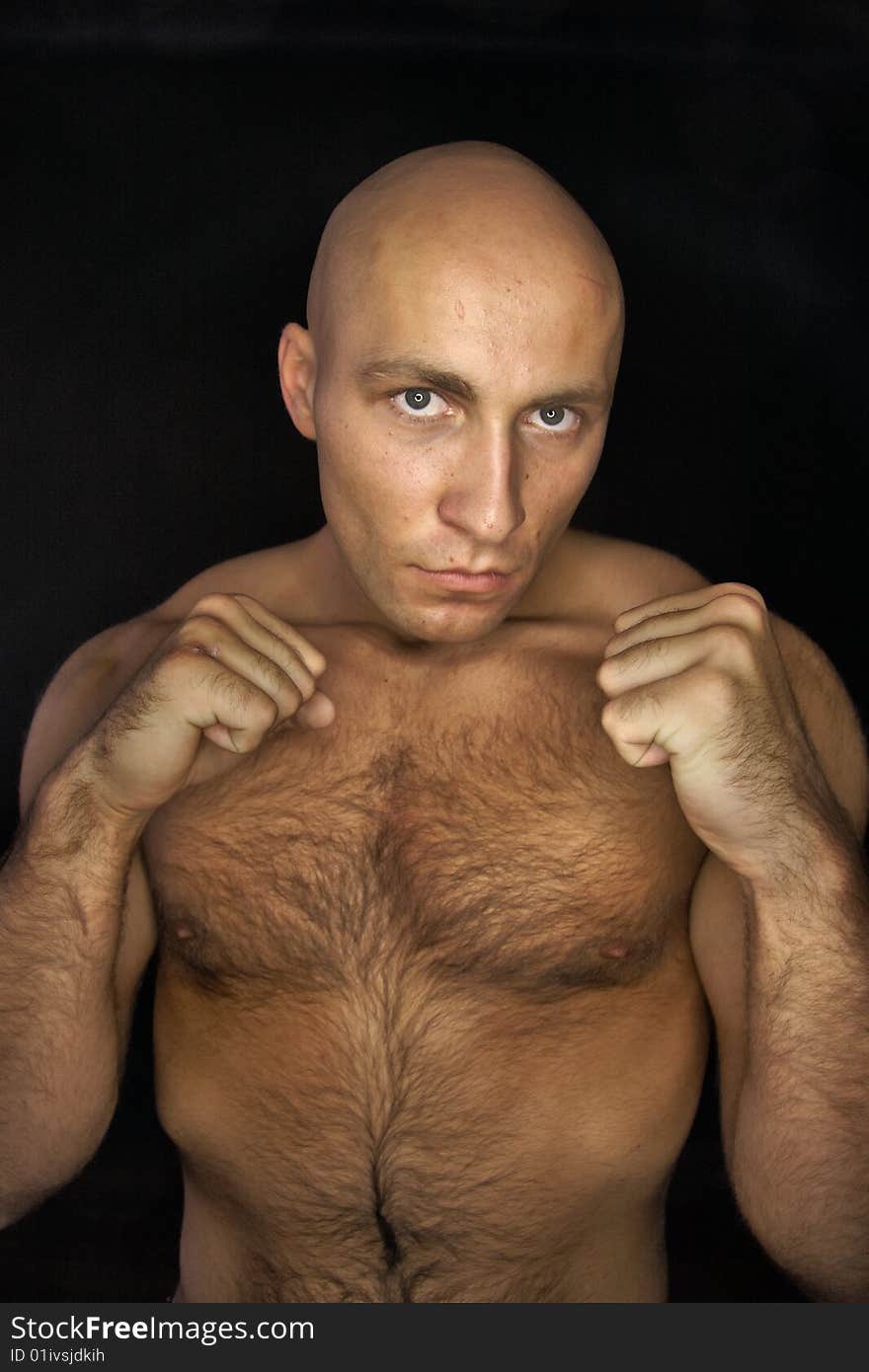 Baldheaded man in fighting stance