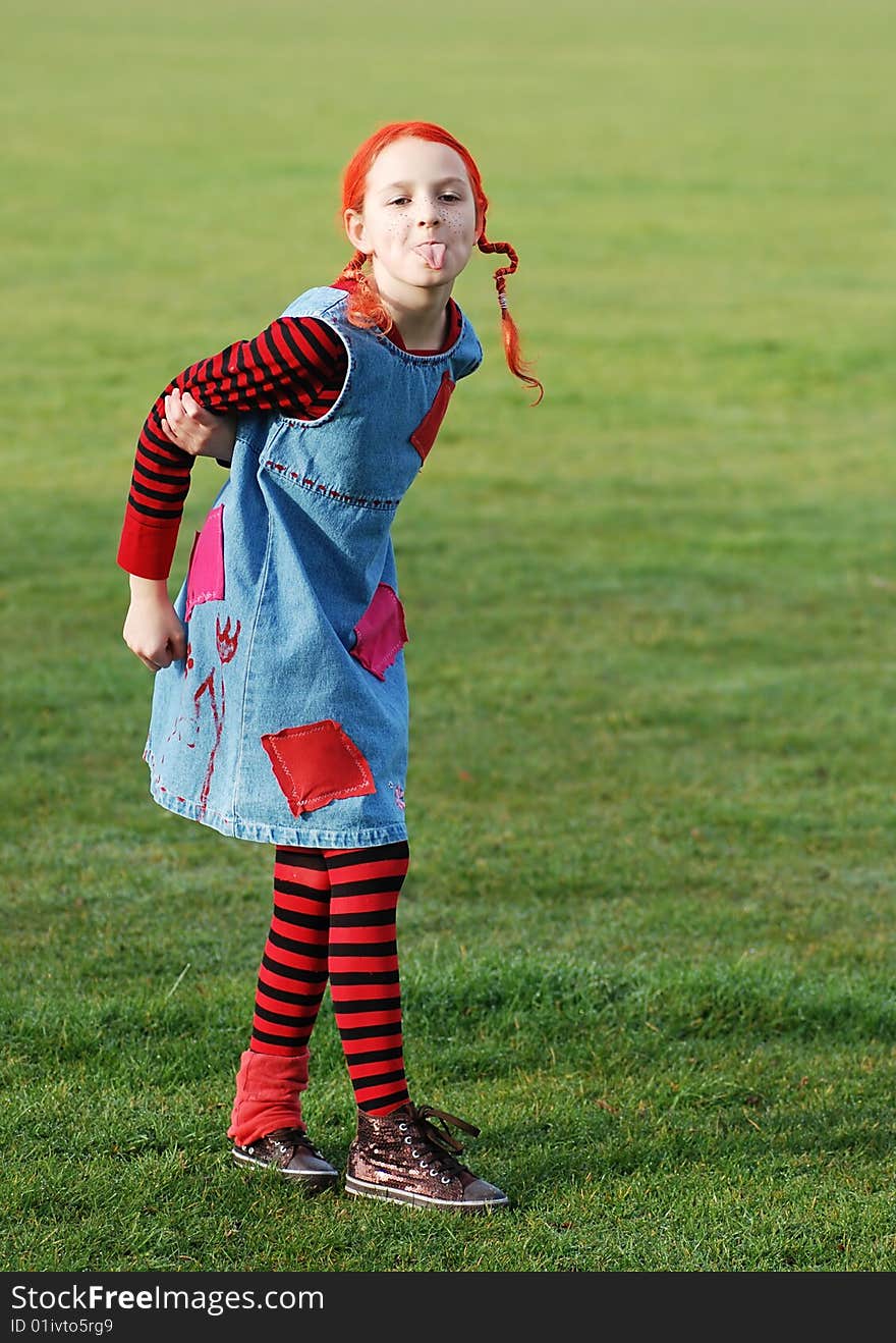 Funny girl in multi-coloured clothes