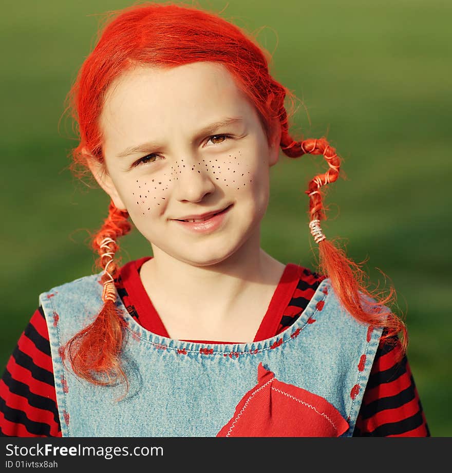 Funny girl in multi-coloured clothes