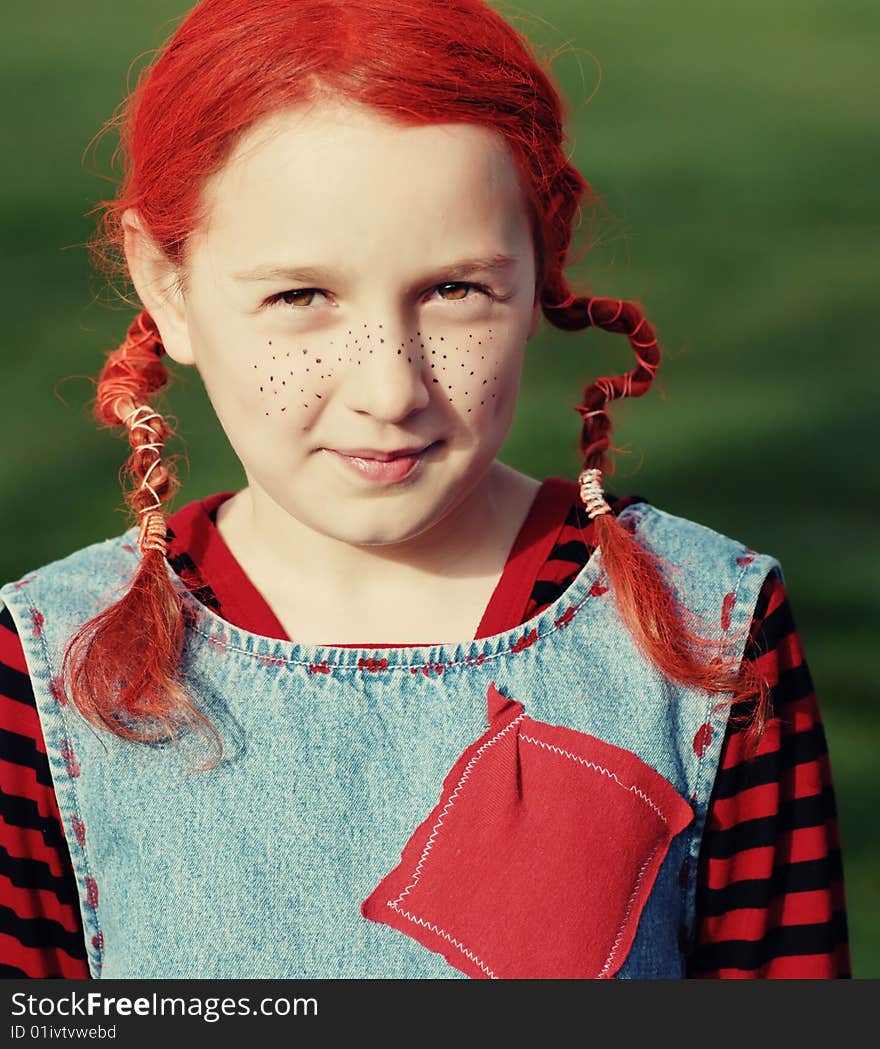 Funny girl in multi-coloured clothes