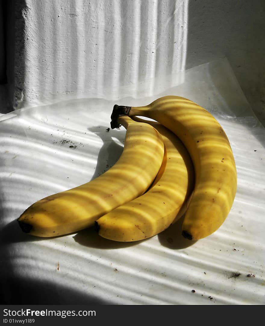 Bananas and stripped shadows from window