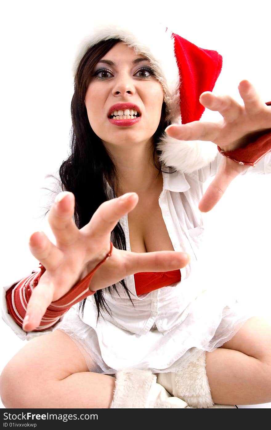 Beautiful woman with christmas hat giving bad expression on an isolated background