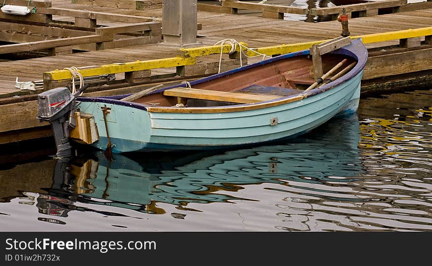 Small Blue Boat at a Pier