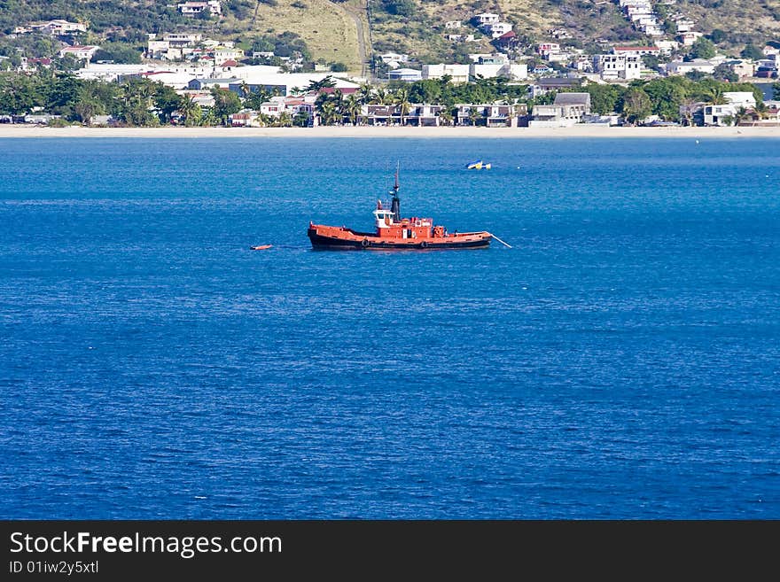 Orange Boat In Blue Water