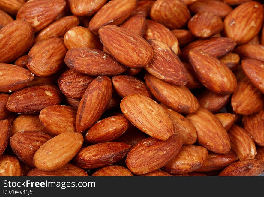 Closeup image of roasted almonds