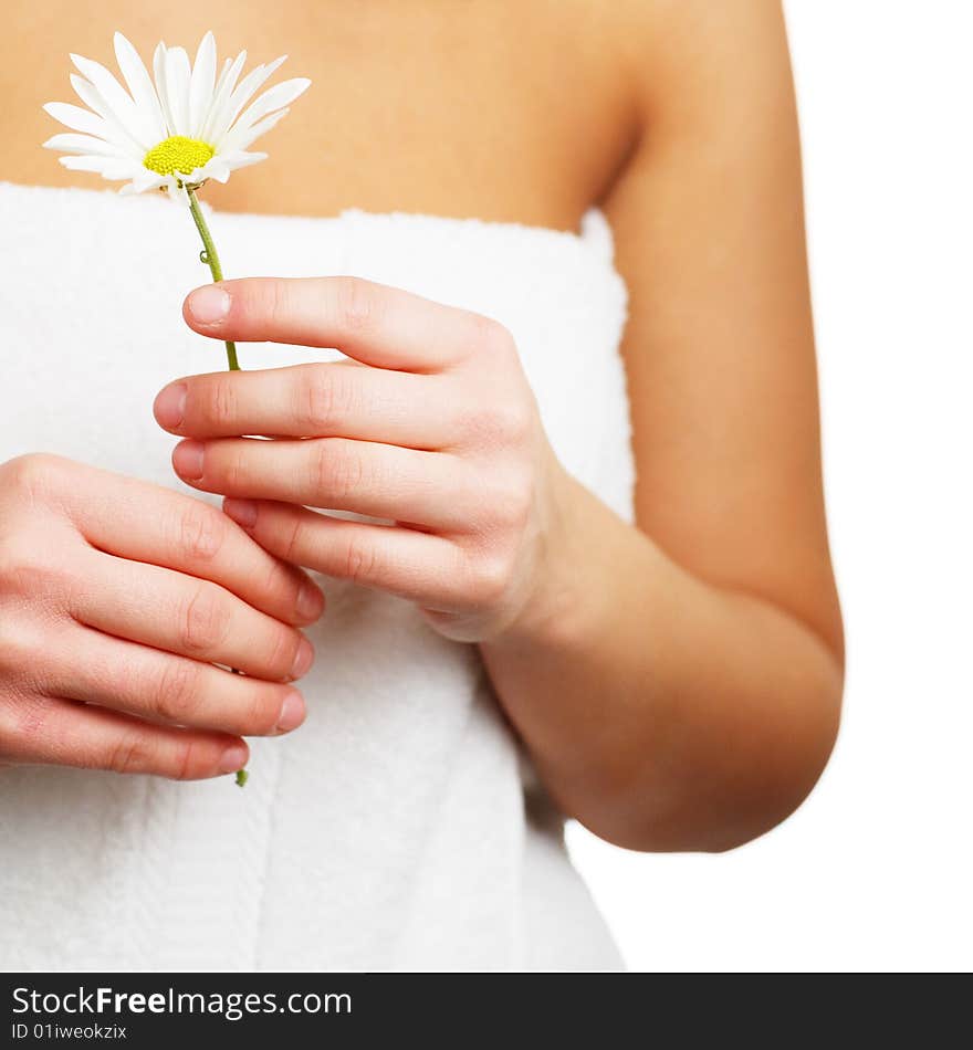 Close up of a spa woman holding a flower. Close up of a spa woman holding a flower.