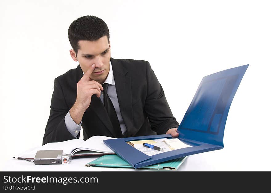 Businessman at work with phone and documents