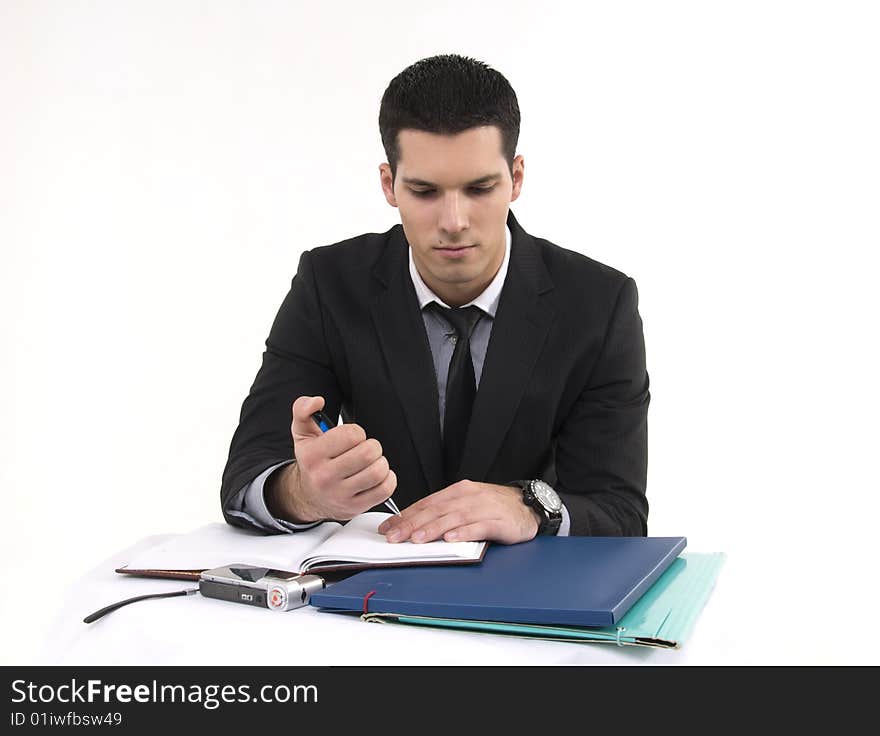 Businessman at work with phone and documents