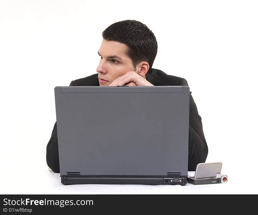 Businessman with lap top computer and phone isolated on white background