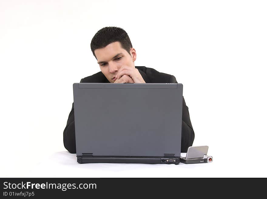 Businessman with lap top computer and phone isolated on white background