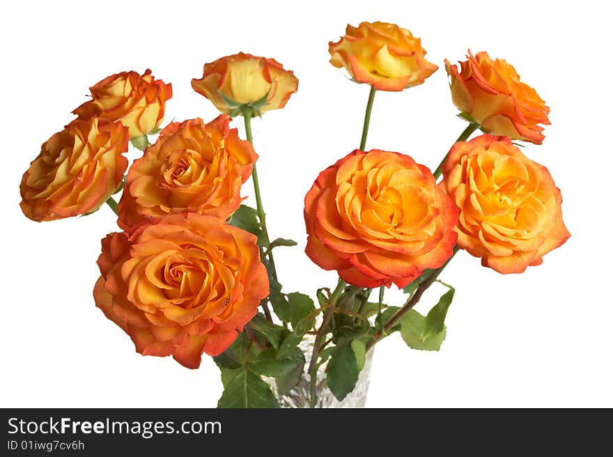 A bouquet of yellow roses in a crystal vase