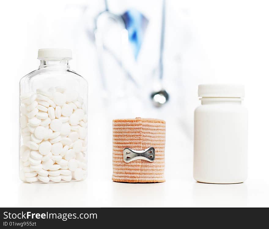 Doctor with medical supplies against a white background.